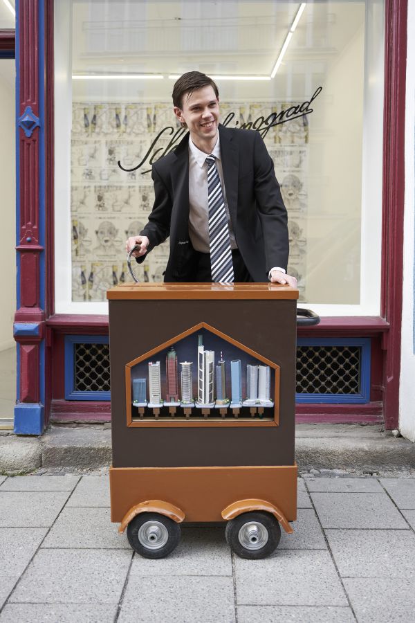 Skyline Organ (Frankfurz), 2021, customized barrel organ, brass pipes covered with architectural models made from cardboard, aluminum foil and acrylic paint, customized punchcard &bdquo;Wind of Change&ldquo;, 100 x 80 x 60cm
